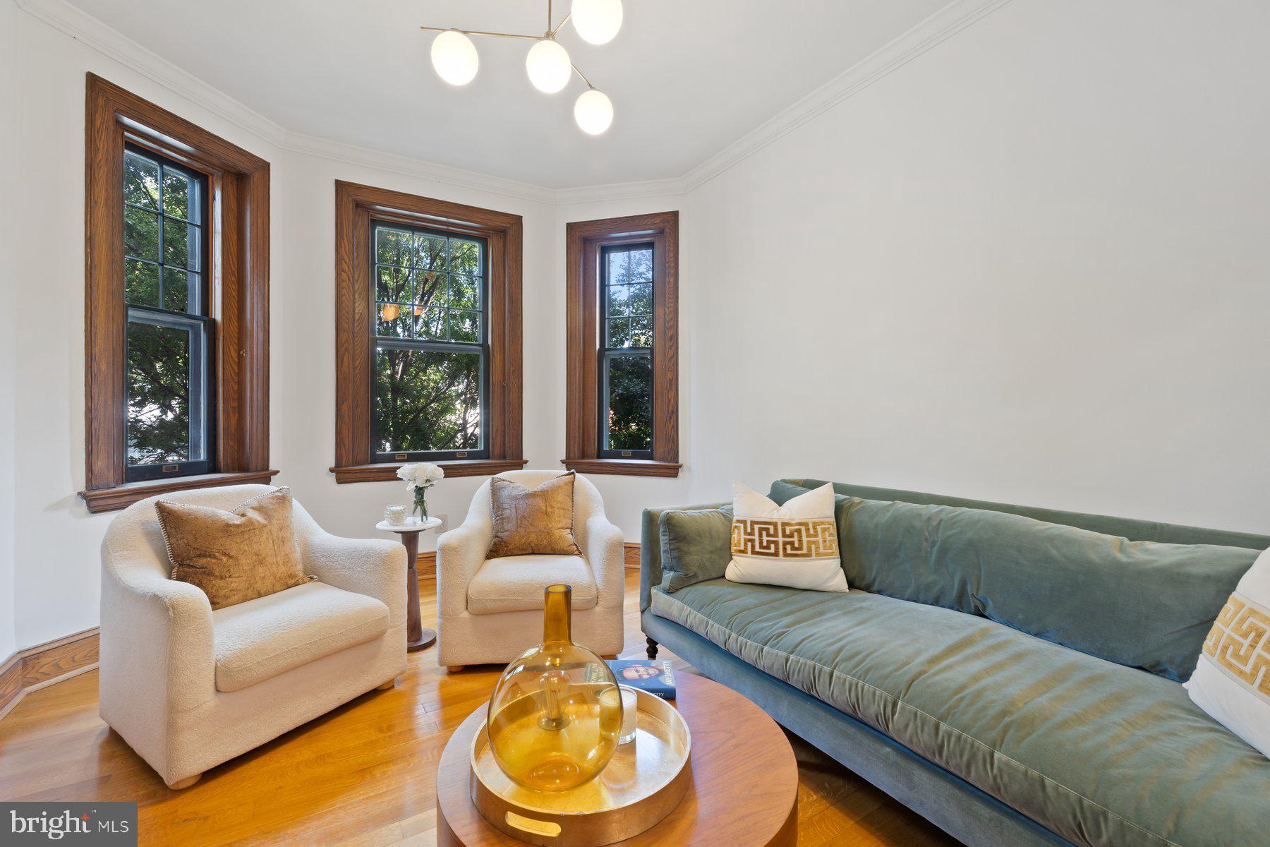 3020 Dent Place Northwest, Unit 30W Washington, DC 20007 - Photo 5 of 37 a living room with furniture and a large window