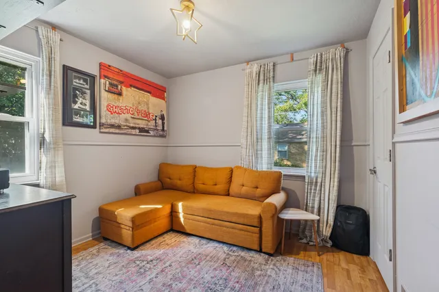 a bathroom with a granite countertop toilet sink and mirror