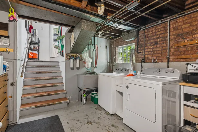 a view of a patio with a table chairs and a yard