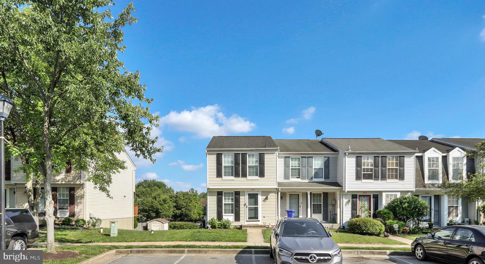2235 Riding Crop Way Windsor Mill, MD 21244 - Photo 1 of 29 a front view of a residential apartment building with a yard
