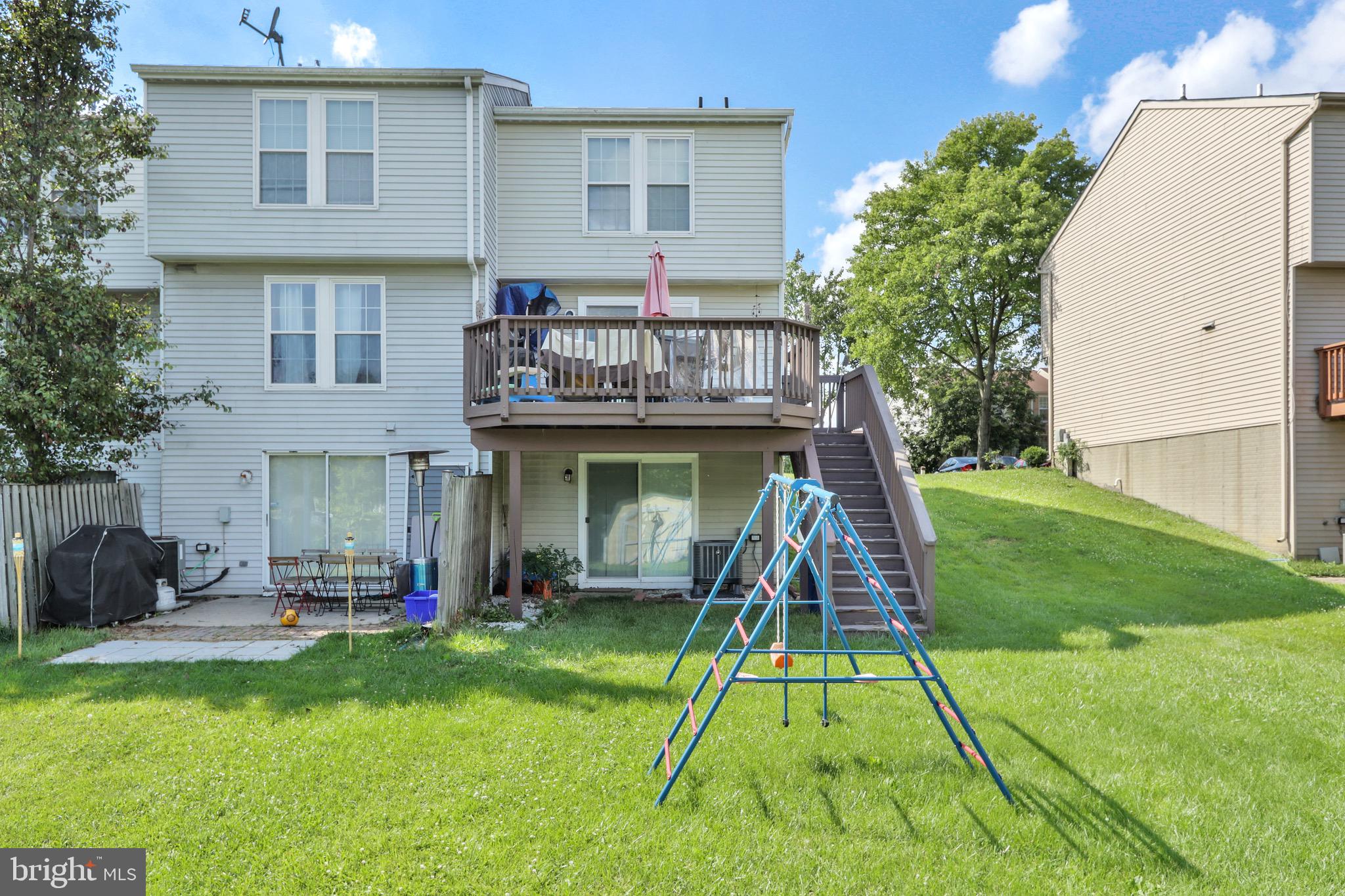 2235 Riding Crop Way Windsor Mill, MD 21244 - Photo 13 of 29 a view of a house with a swimming pool and a yard