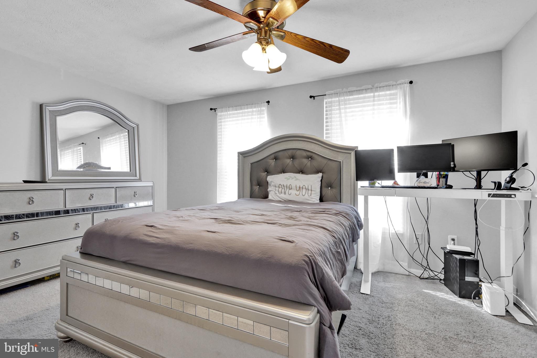 2235 Riding Crop Way Windsor Mill, MD 21244 - Photo 15 of 29 a bedroom with a bed and a flat screen tv
