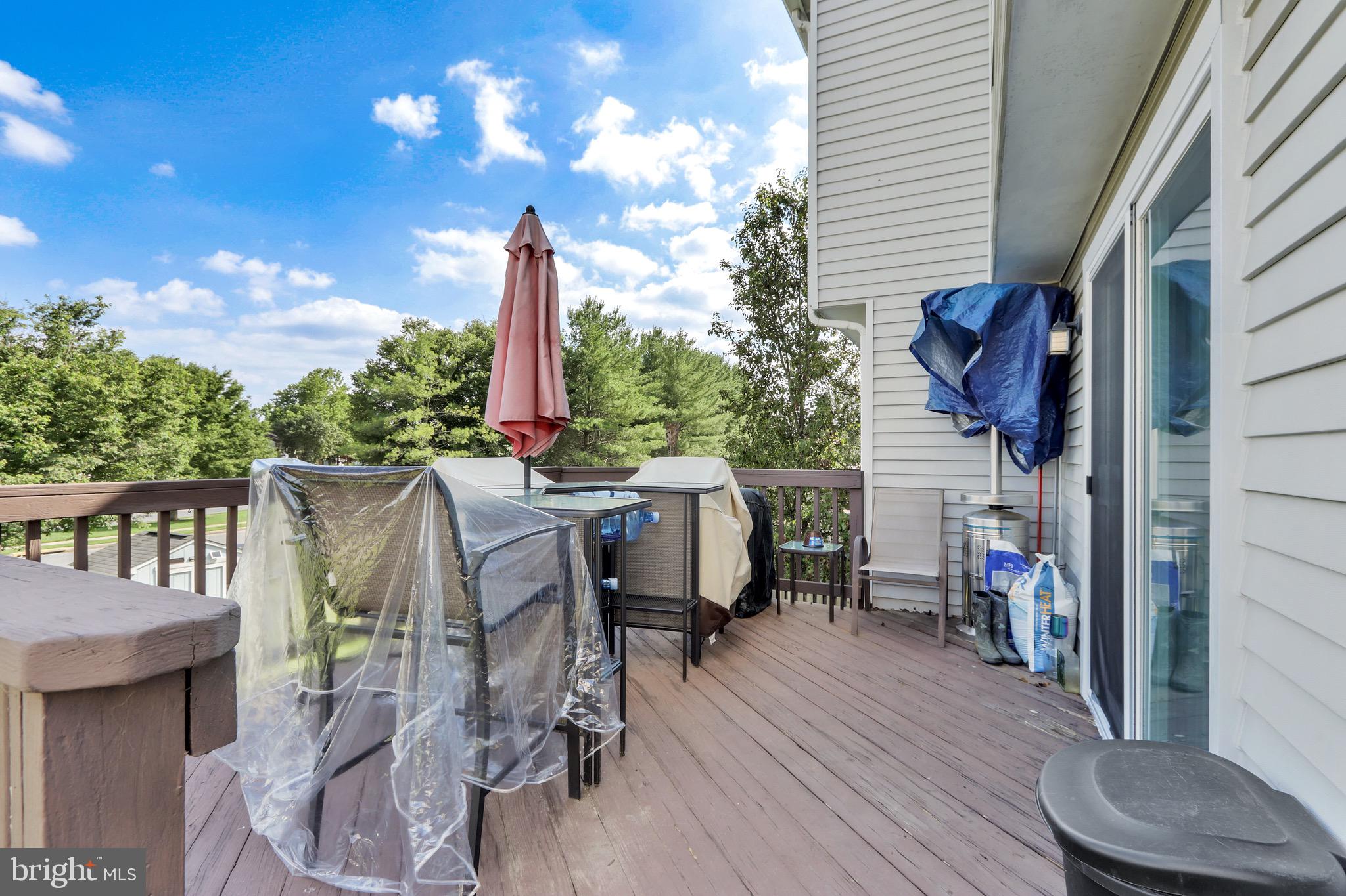 2235 Riding Crop Way Windsor Mill, MD 21244 - Photo 18 of 29 a view of a patio with a table and chairs