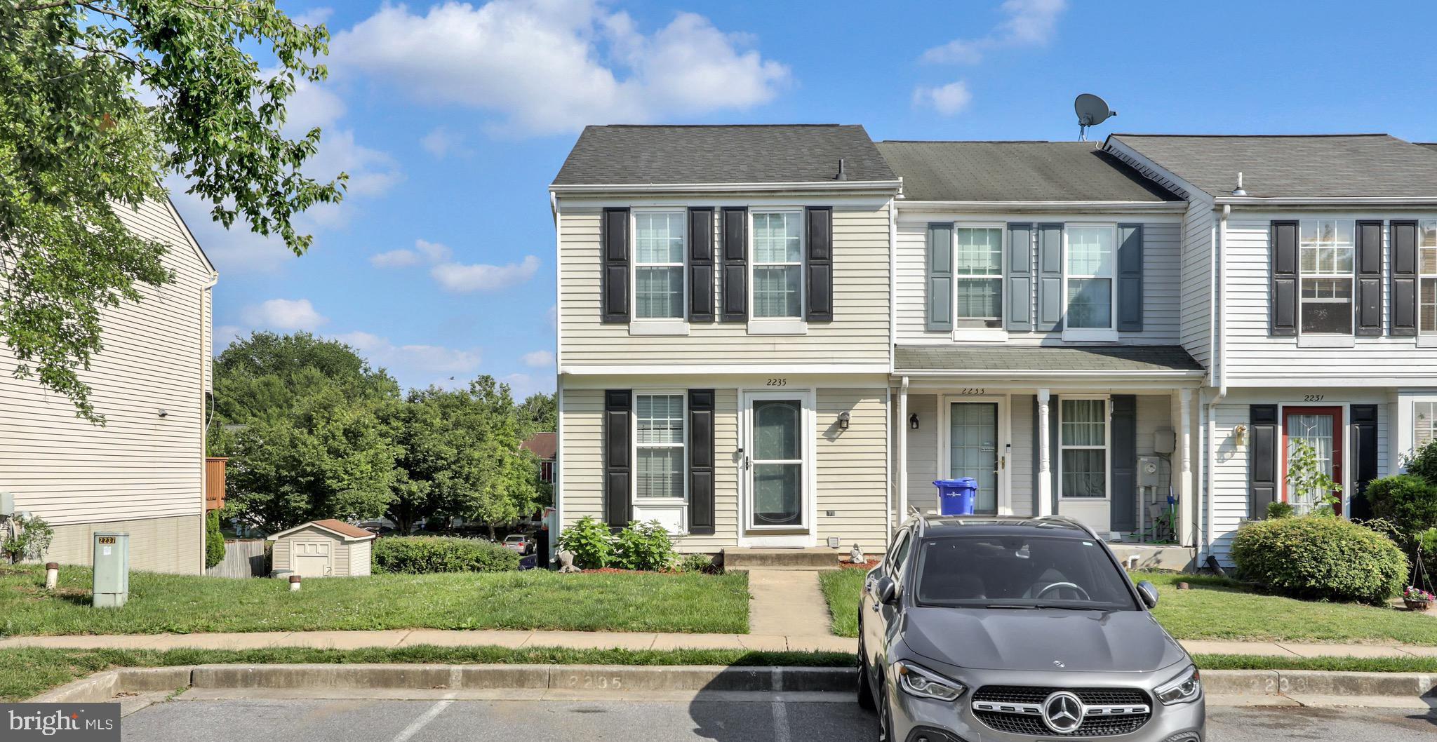 2235 Riding Crop Way Windsor Mill, MD 21244 - Photo 19 of 29 a view of a house with a yard and plants