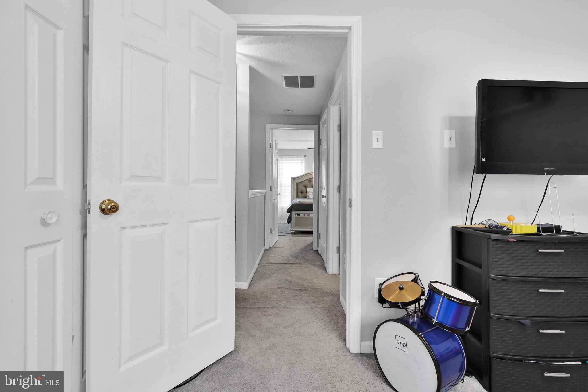 2235 Riding Crop Way Windsor Mill, MD 21244 - Photo 25 of 29 a living room with furniture and a flat screen tv