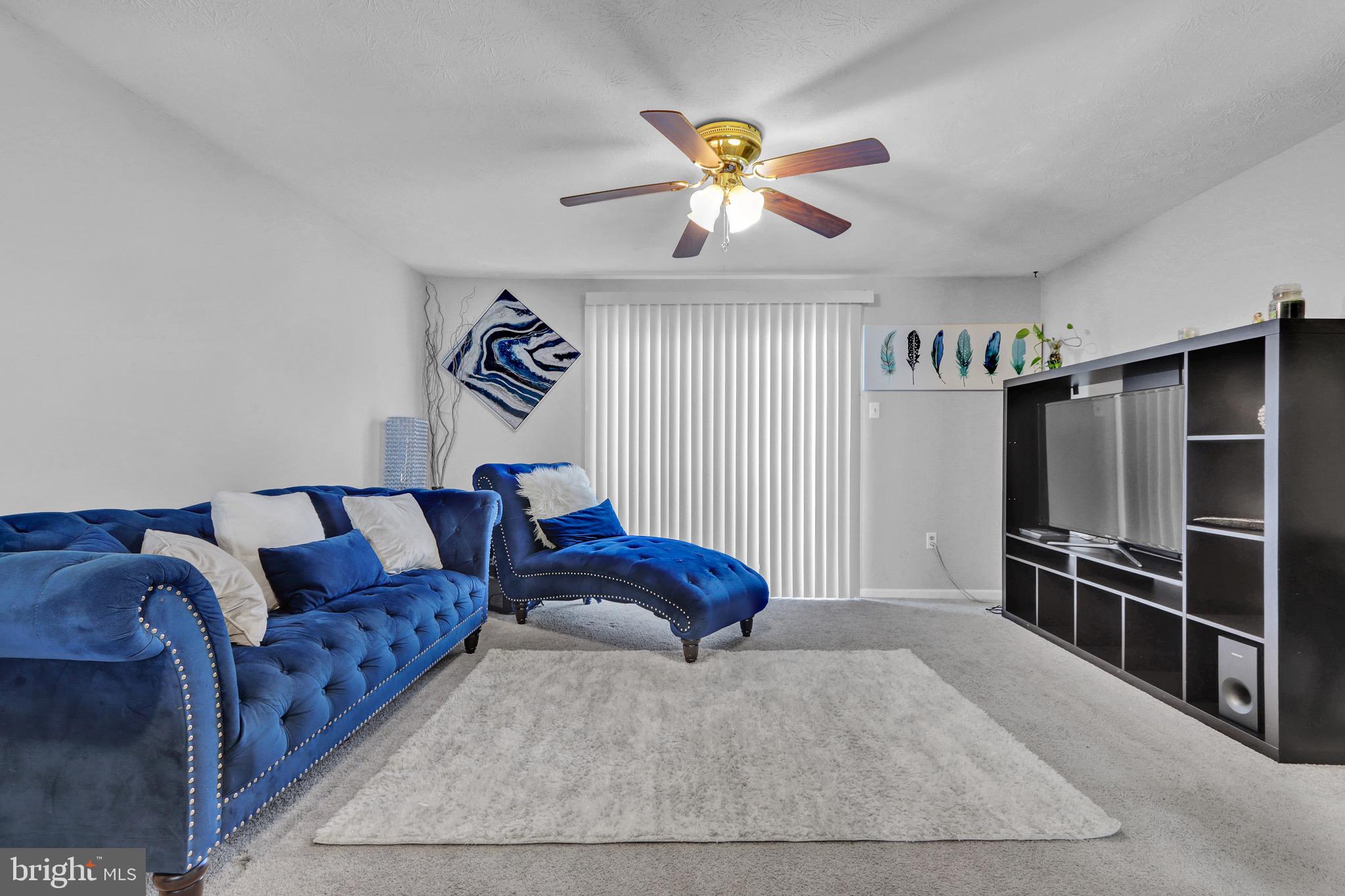 2235 Riding Crop Way Windsor Mill, MD 21244 - Photo 3 of 29 a bedroom with furniture and a ceiling fan