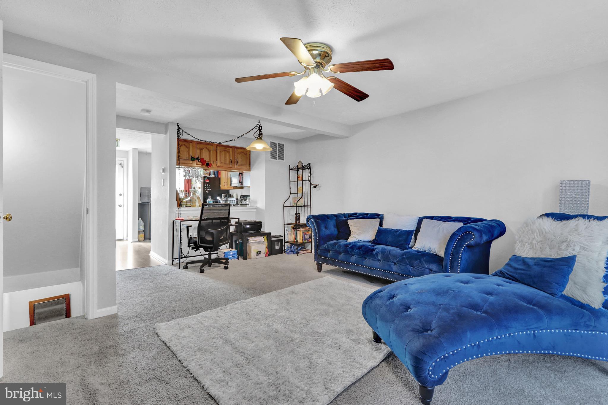 2235 Riding Crop Way Windsor Mill, MD 21244 - Photo 4 of 29 a living room with furniture and white walls