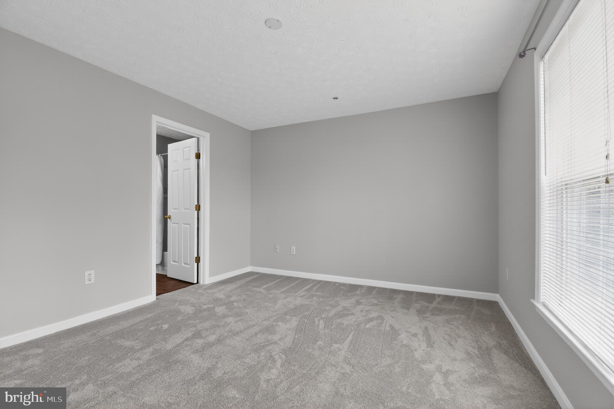 2058 Quaker Way, Unit 12 Annapolis, MD 21401 - Photo 12 of 27 a view of an empty room and a window
