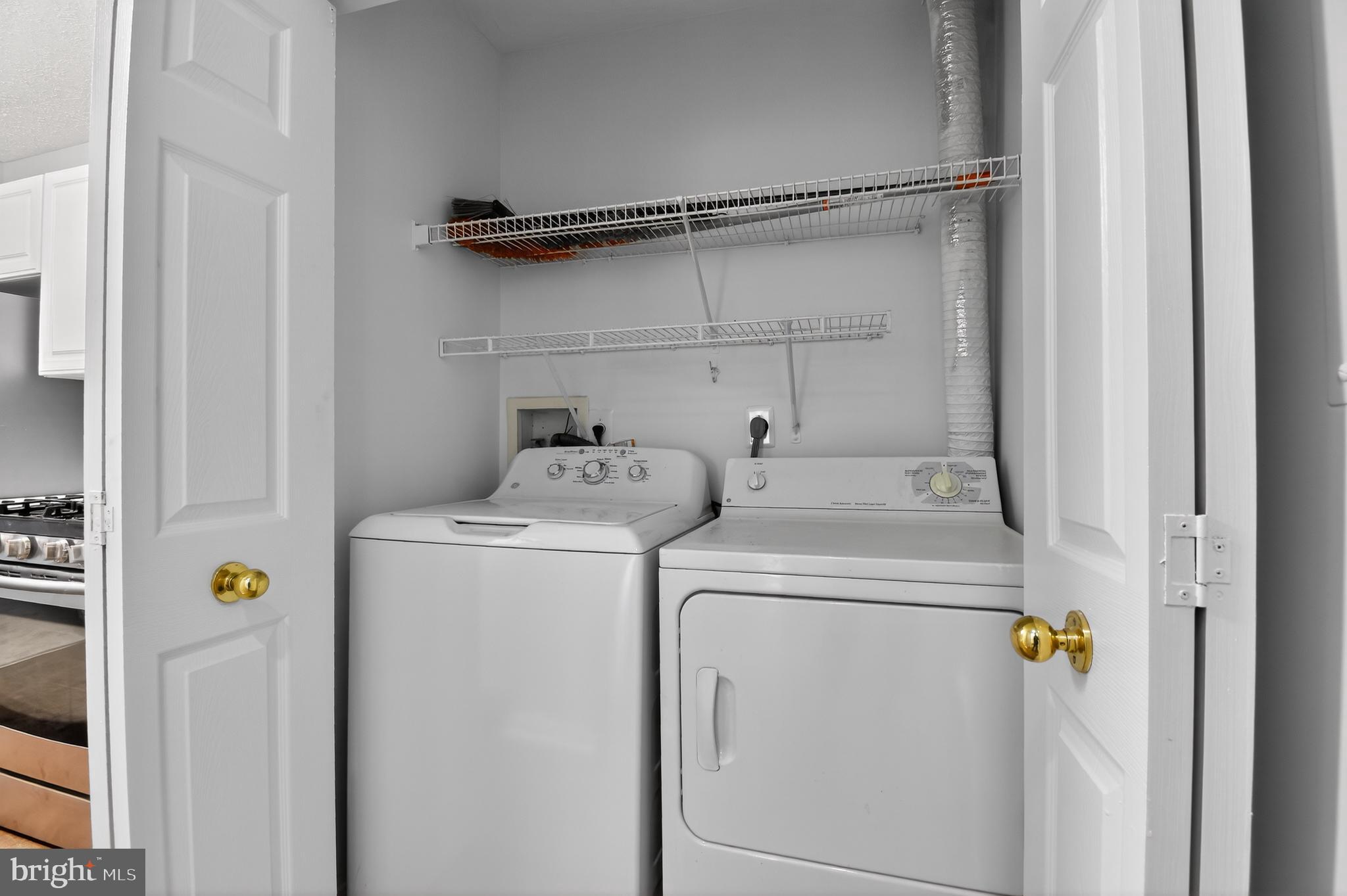 2058 Quaker Way, Unit 12 Annapolis, MD 21401 - Photo 17 of 27 a utility room with dryer and washer