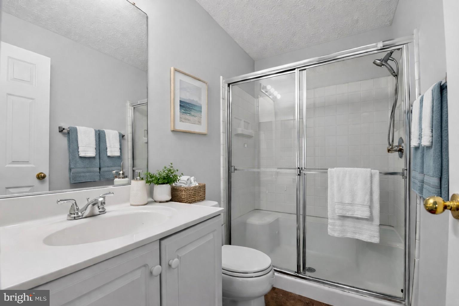 2058 Quaker Way, Unit 12 Annapolis, MD 21401 - Photo 23 of 27 a bathroom with a granite countertop sink toilet and shower