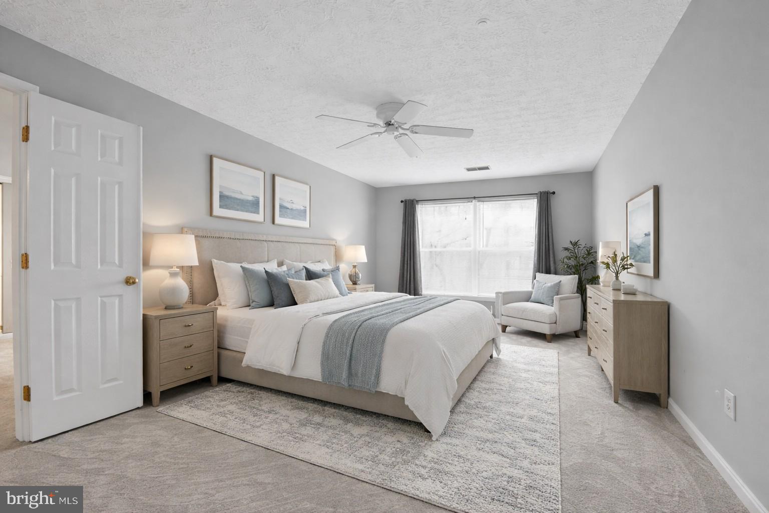 2058 Quaker Way, Unit 12 Annapolis, MD 21401 - Photo 24 of 27 a spacious bedroom with a bed and a couch
