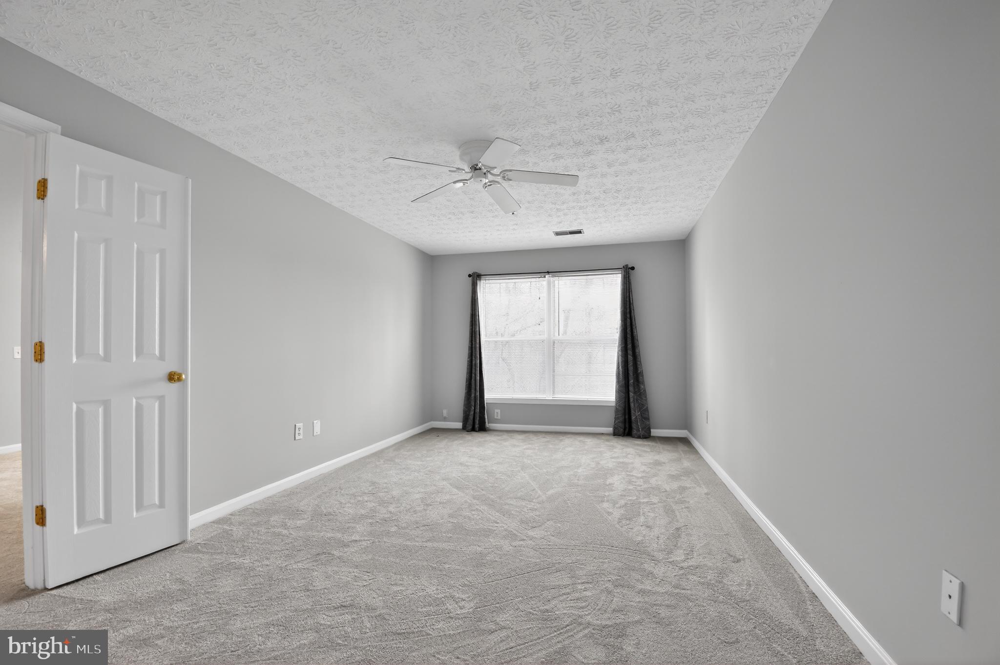 2058 Quaker Way, Unit 12 Annapolis, MD 21401 - Photo 5 of 27 wooden floor in an empty room with a window