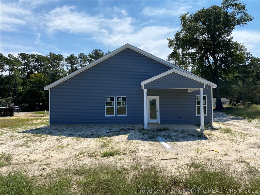 601 Laurel Lake Road Salemburg, NC 28385 - Photo 15 of 17 a view of a house with a yard