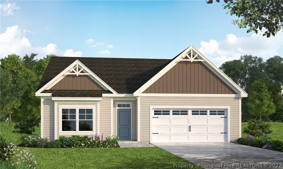 601 Laurel Lake Road Salemburg, NC 28385 - Photo 16 of 17 a front view of a house with a yard