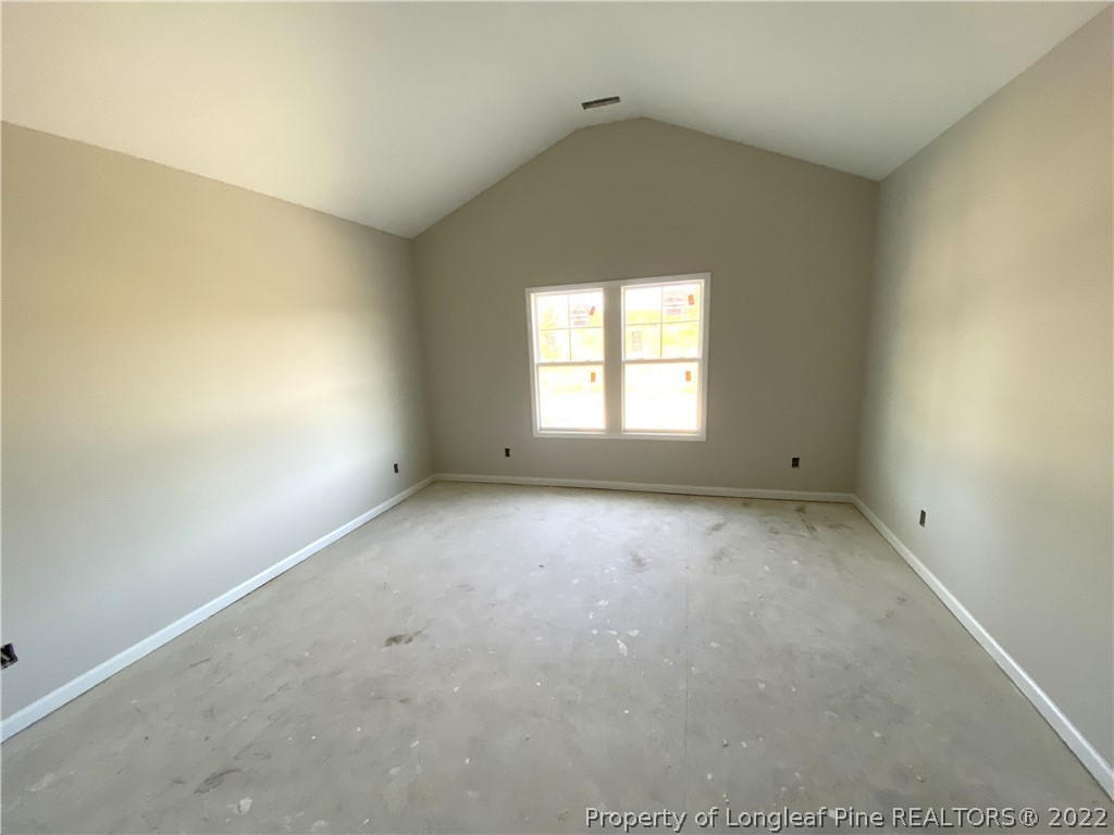 601 Laurel Lake Road Salemburg, NC 28385 - Photo 5 of 17 an empty room with a windows and closet