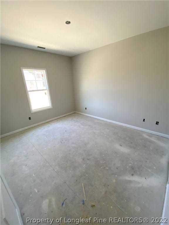 601 Laurel Lake Road Salemburg, NC 28385 - Photo 9 of 17 an empty room with a window