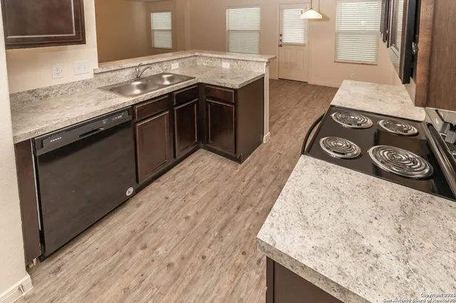 a kitchen with a stove and a sink