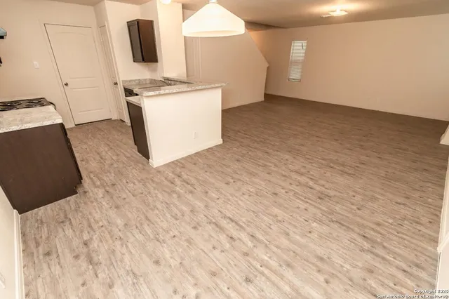 a view of kitchen with sink washer and dryer