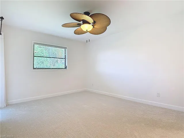 a bathroom with a bathtub shower sink vanity mirror and toilet