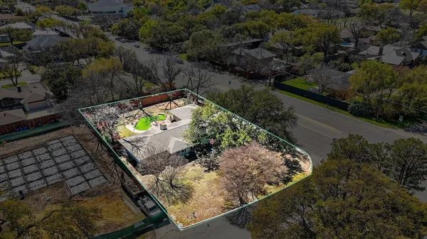 a view of a backyard and outdoor seating