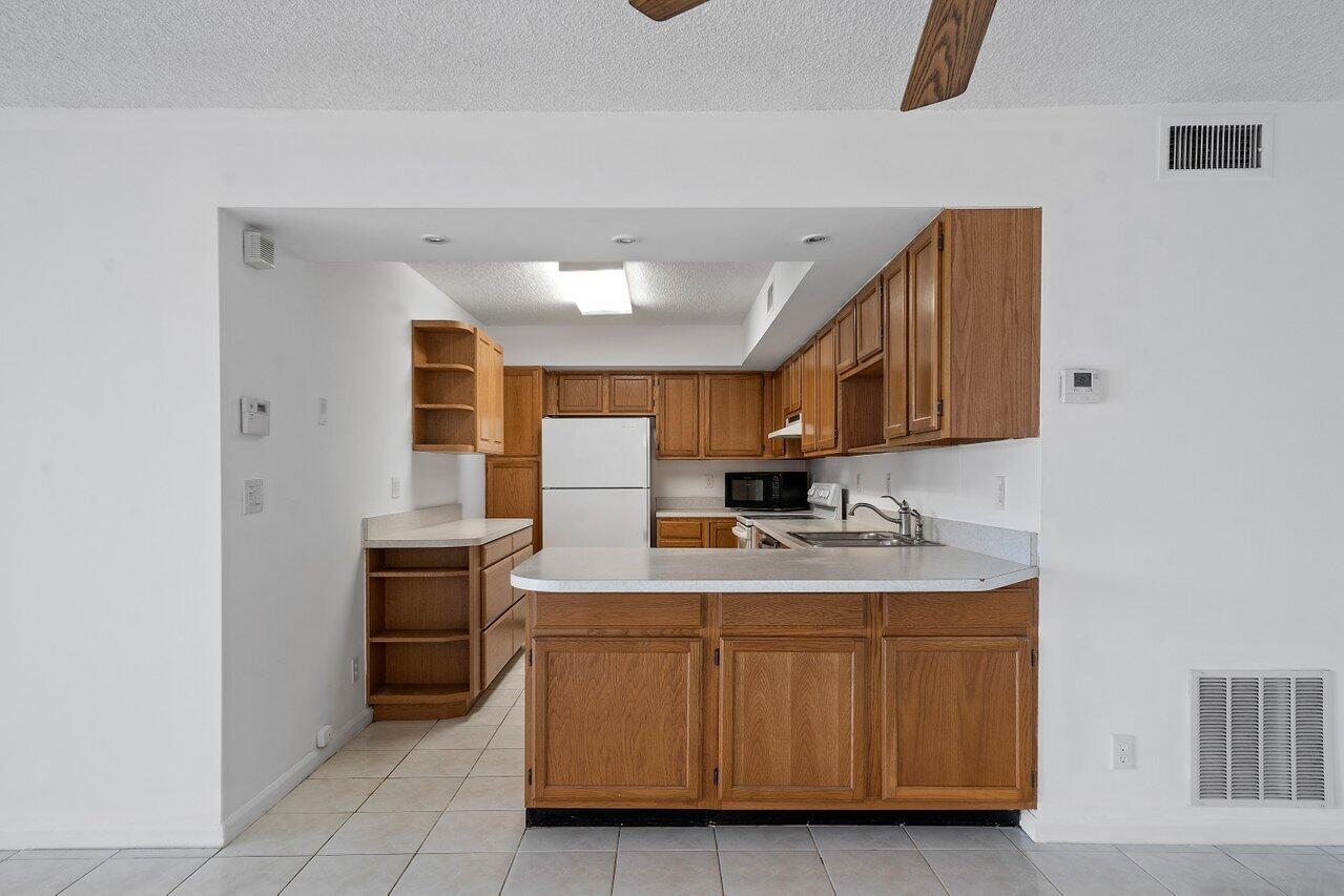3190 Leewood Terrace, Unit L104 Boca Raton, FL 33431 - Photo 17 of 24 Kitchen