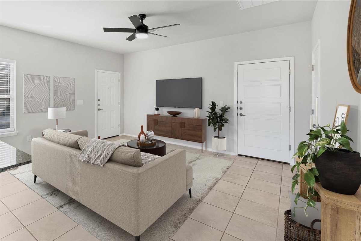 1202 Garland Road Georgetown, TX 78626 - Photo 5 of 28 Open living area featuring tiled flooring throughout, a modern ceiling fan with integrated lighting, and light-toned walls