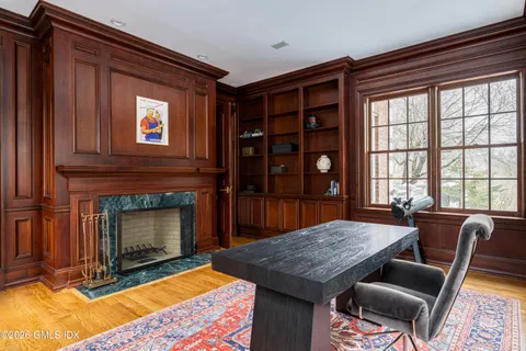 a view of a livingroom with furniture and a fireplace