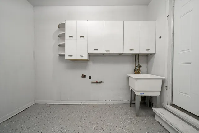 a bathroom with a sink and cabinets