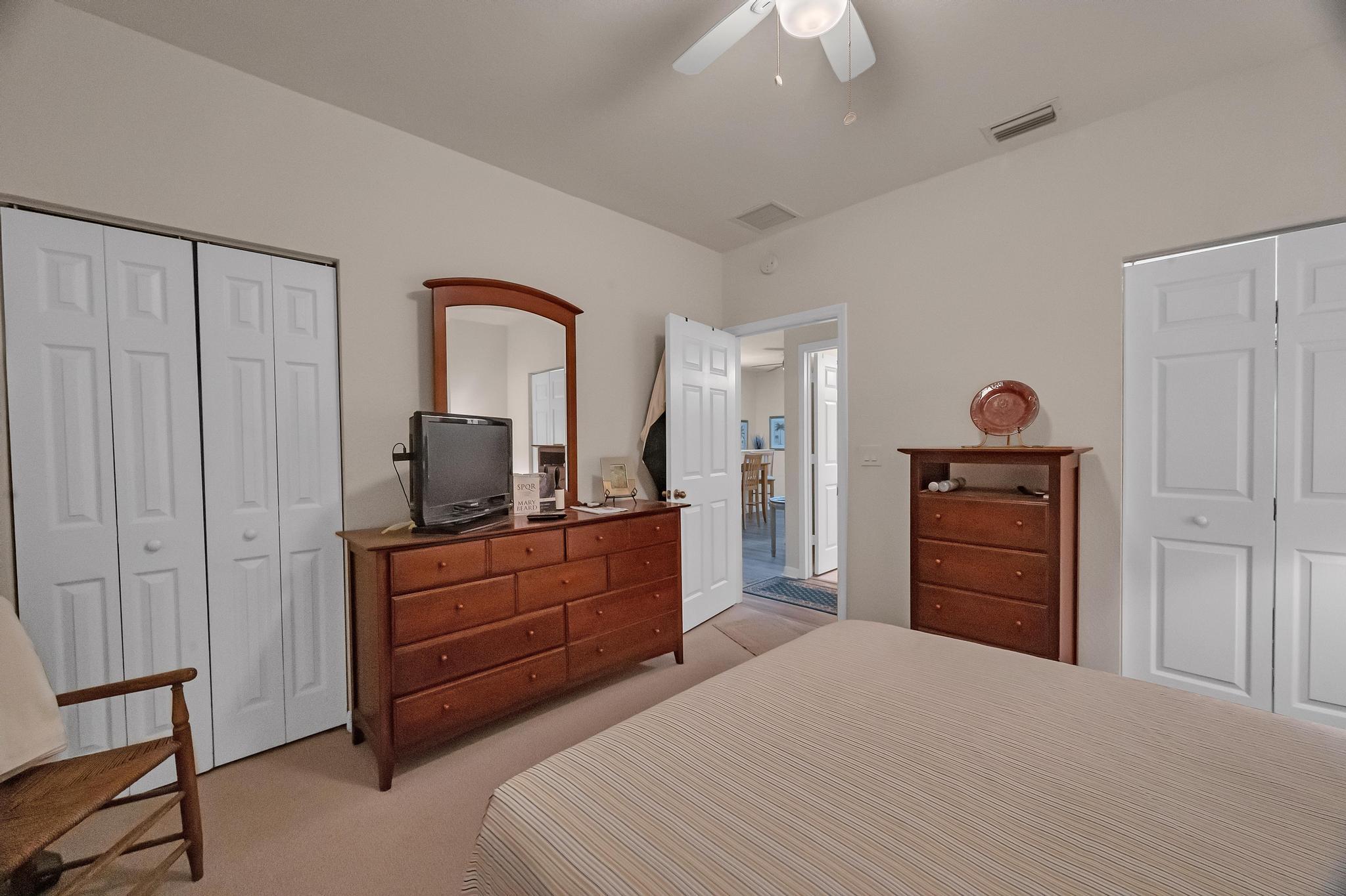 367 Southeast Rogers Court Stuart, FL 34994 - Photo 12 of 35 a bedroom with a bed and a dresser