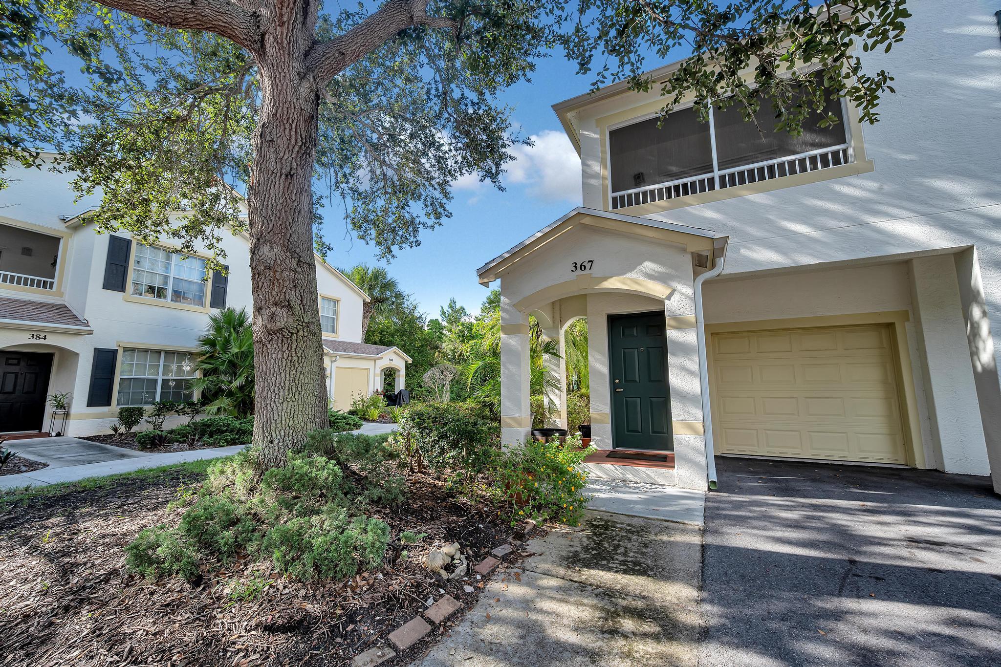 367 Southeast Rogers Court Stuart, FL 34994 - Photo 24 of 35 a front view of a house with garden