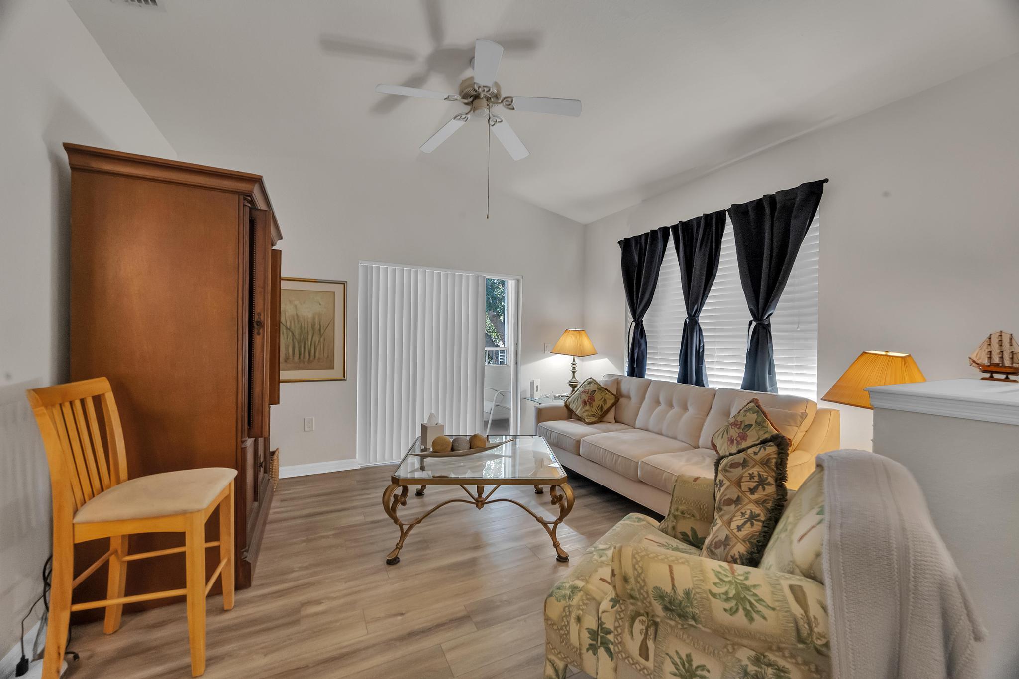 367 Southeast Rogers Court Stuart, FL 34994 - Photo 3 of 35 a living room with furniture and a window