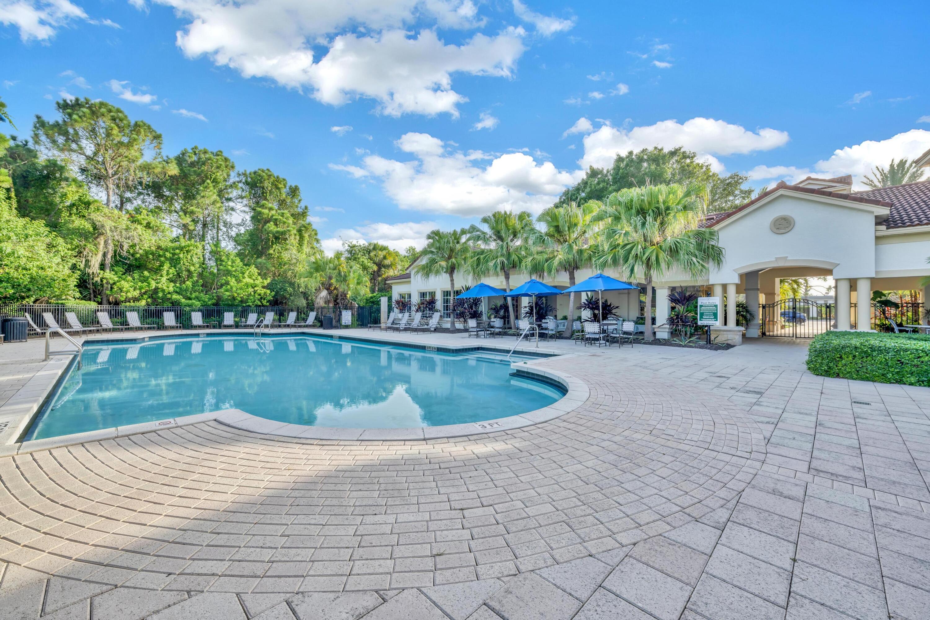 367 Southeast Rogers Court Stuart, FL 34994 - Photo 34 of 35 a view of yard with swimming pool and outdoor seating