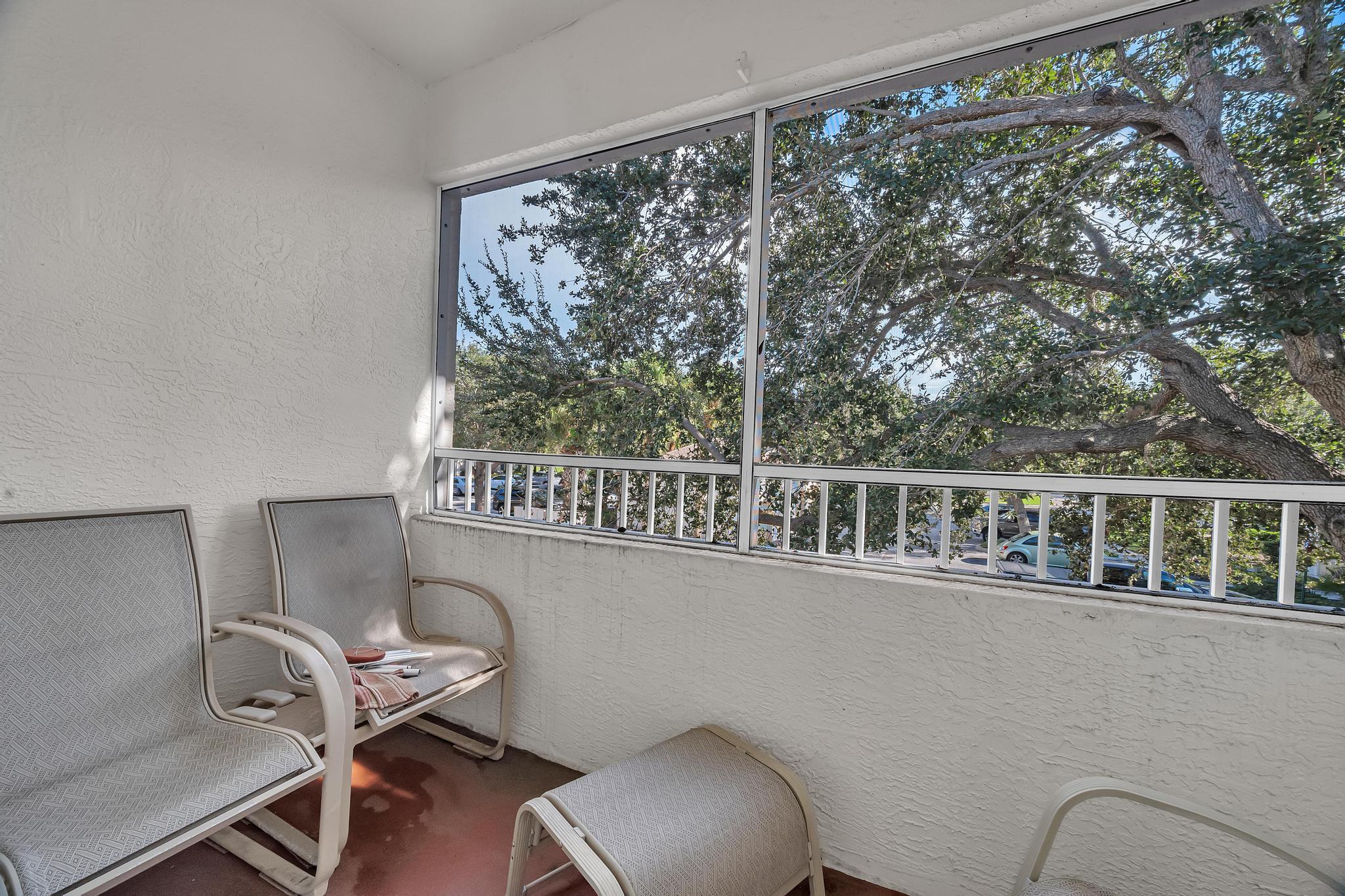 367 Southeast Rogers Court Stuart, FL 34994 - Photo 4 of 35 a view of a chair and table in a balcony