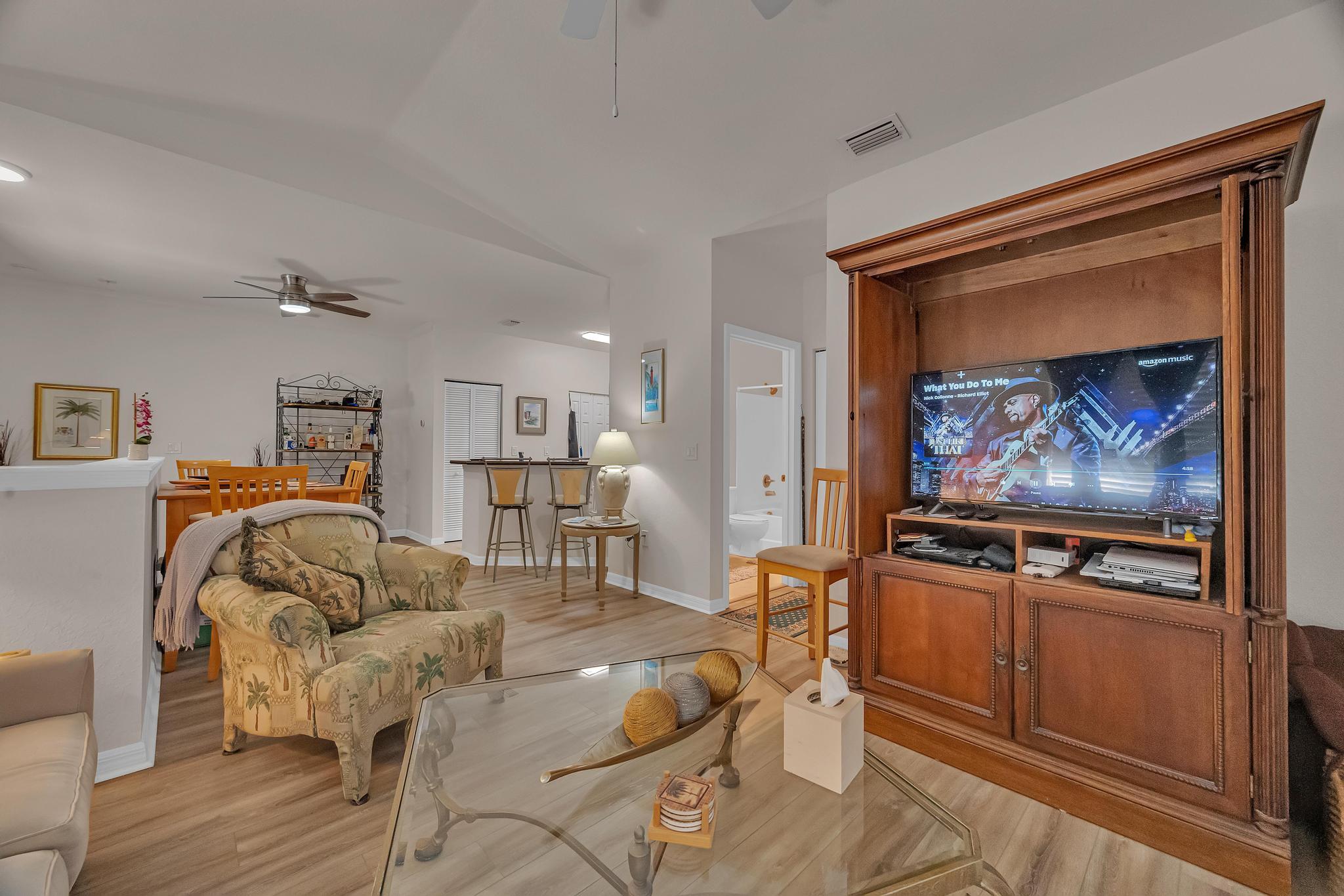 367 Southeast Rogers Court Stuart, FL 34994 - Photo 6 of 35 a living room with furniture and a flat screen tv
