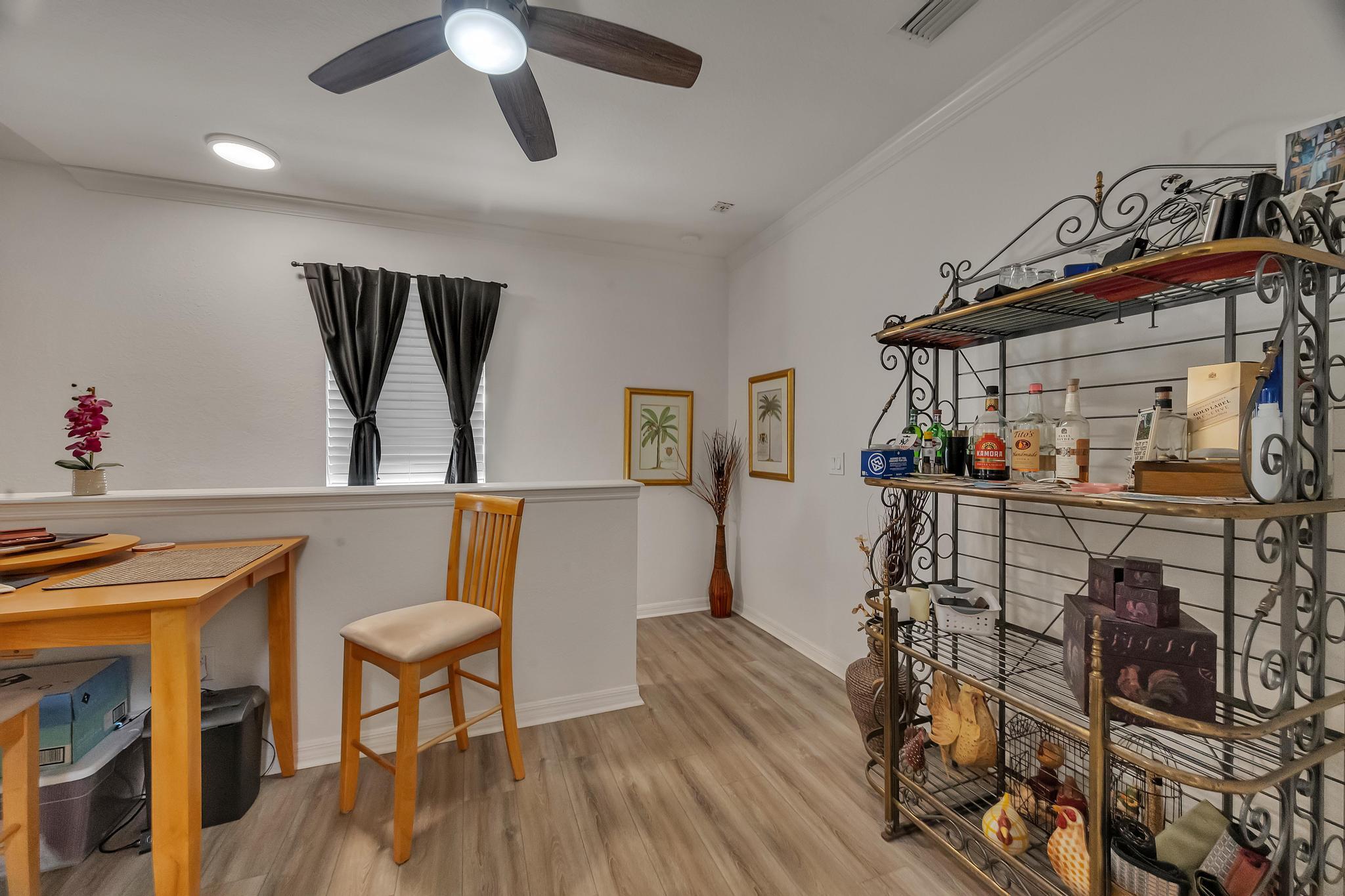 367 Southeast Rogers Court Stuart, FL 34994 - Photo 7 of 35 a view of a dining room with furniture and wooden floor