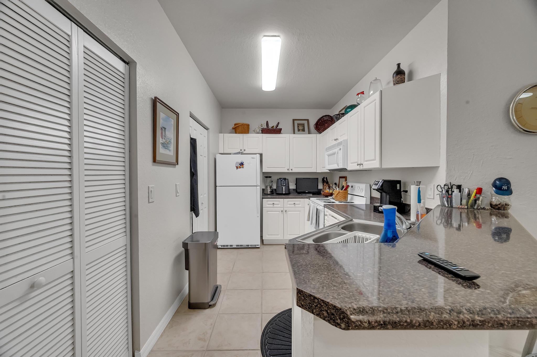 367 Southeast Rogers Court Stuart, FL 34994 - Photo 8 of 35 a view of a living room and kitchen