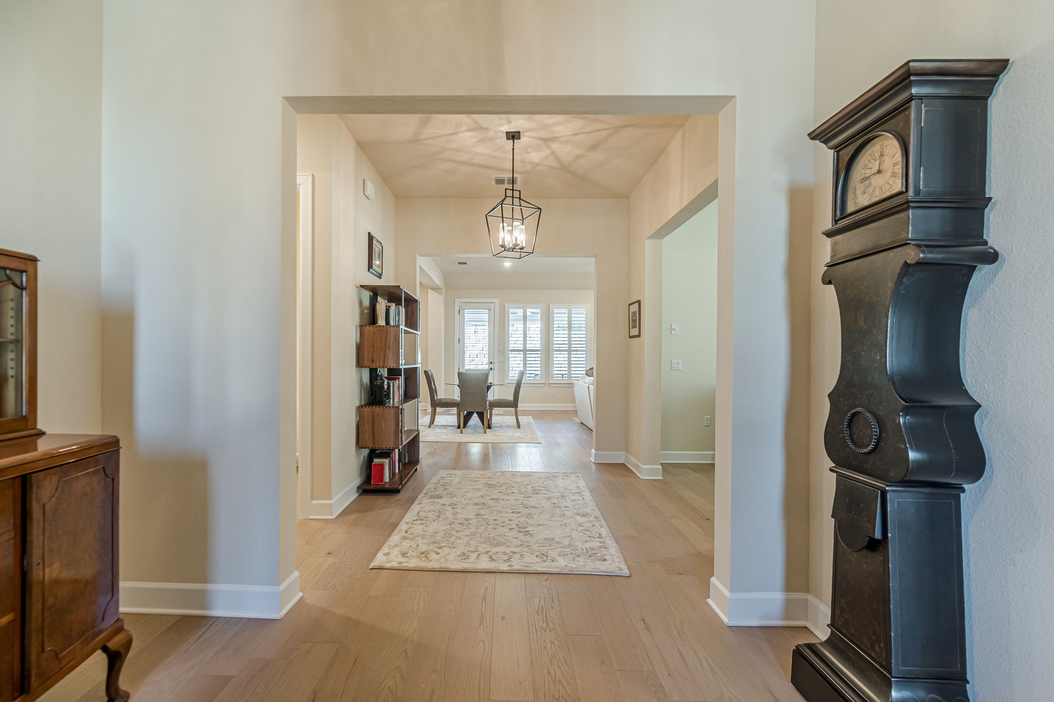 136 Calming Agave Way San Marcos, TX 78666 - Photo 5 of 40 a view of a hallway to a livingroom and a chandelier