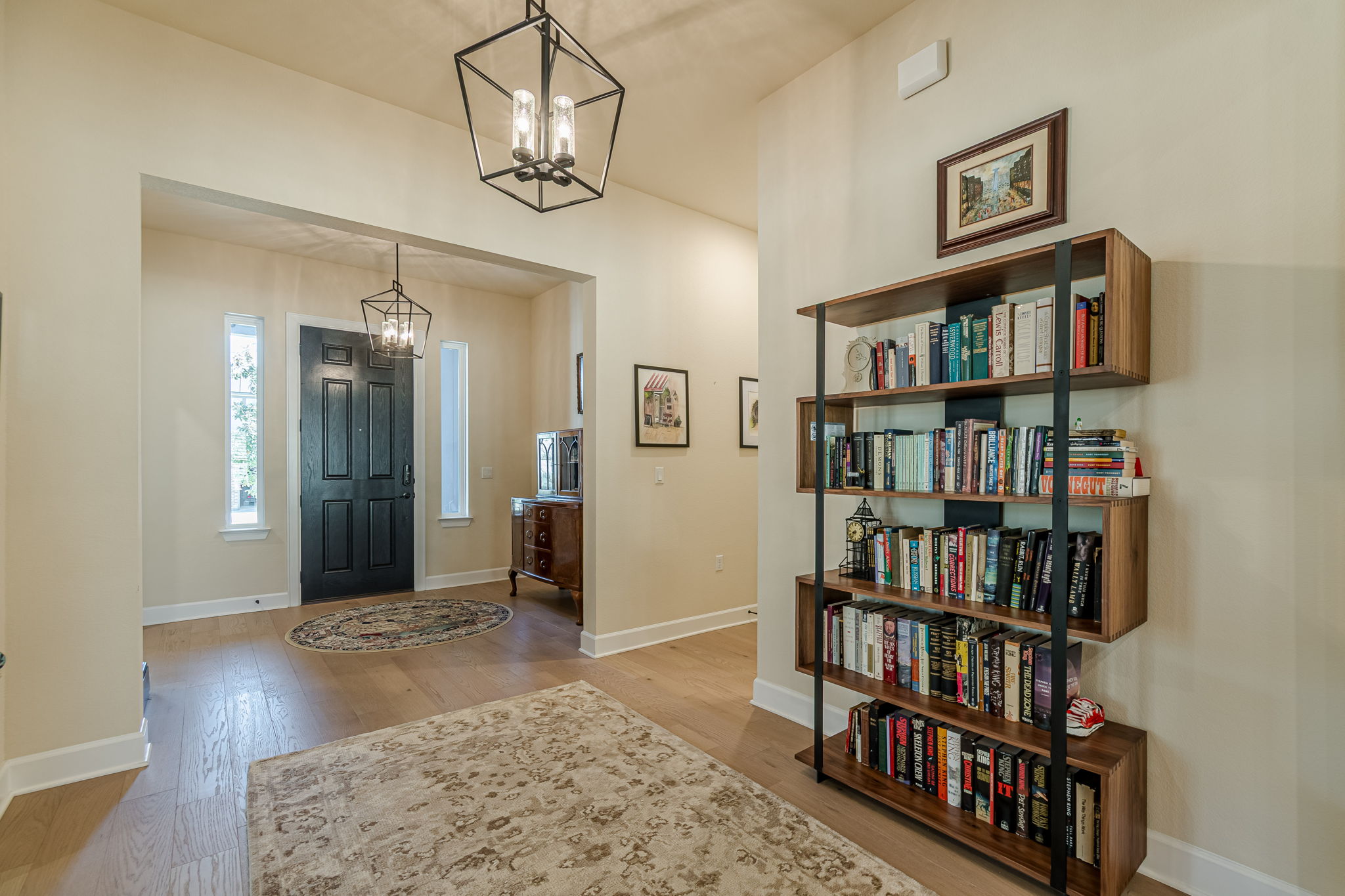 136 Calming Agave Way San Marcos, TX 78666 - Photo 7 of 40 a view of a livingroom with a bookshelf