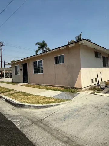 a view of a house with a yard and garage