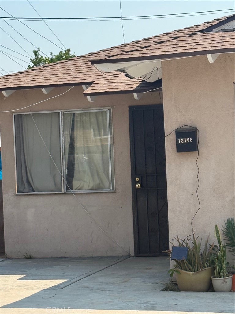 13108 Brock Avenue Paramount, CA 90723 - Photo 15 of 16 a view of a door of the house