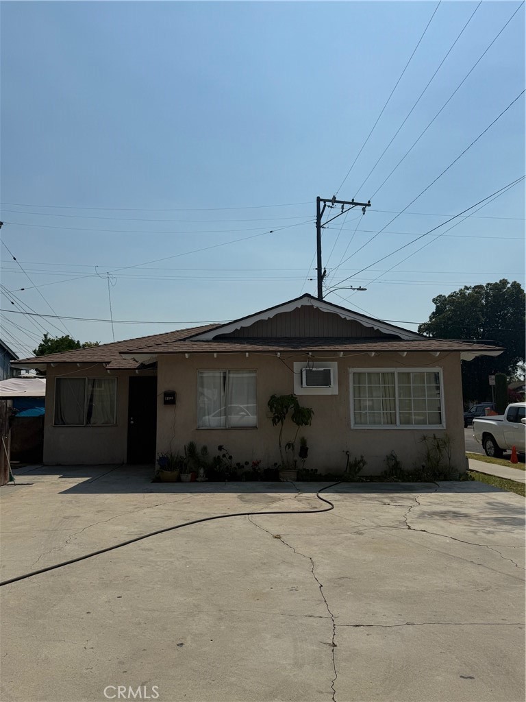 13108 Brock Avenue Paramount, CA 90723 - Photo 16 of 16 a front view of a house with a yard