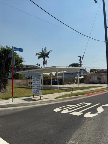 a view of a swimming pool with a lawn chairs
