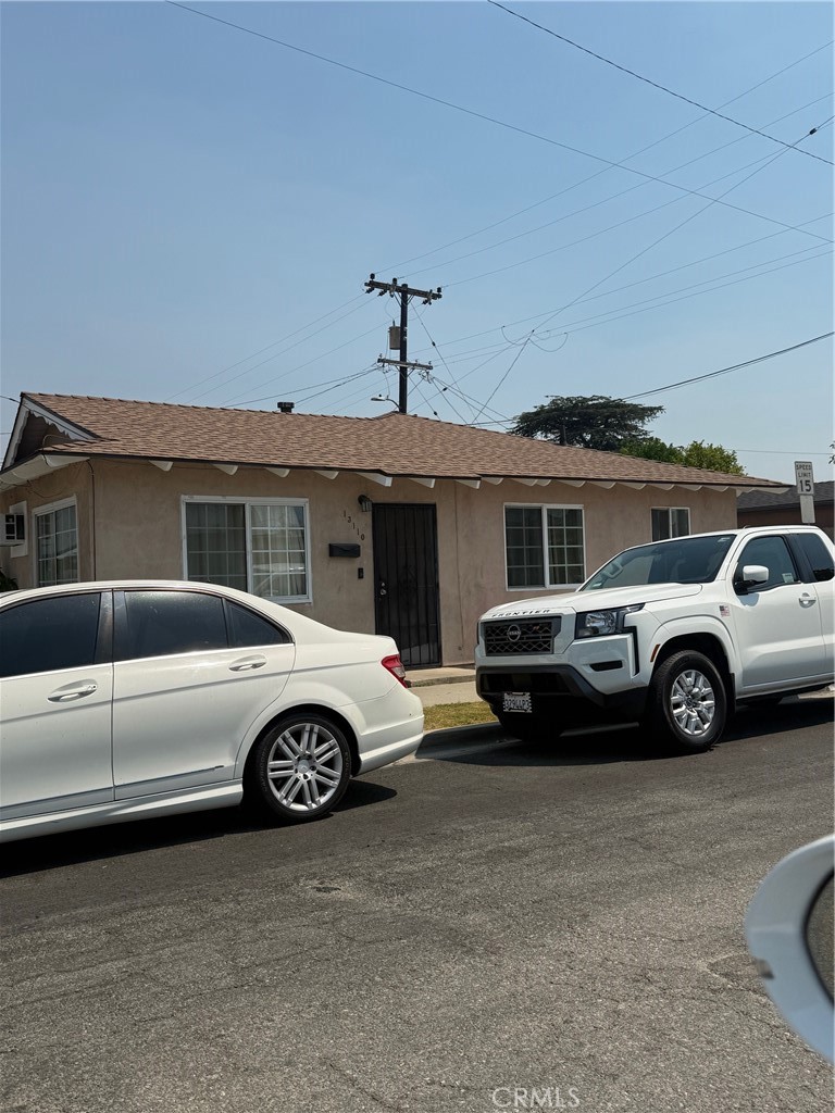 13108 Brock Avenue Paramount, CA 90723 - Photo 9 of 16 a car parked in front of a house