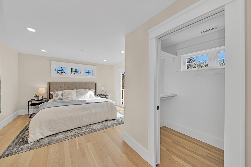 401 Albemarle Road, Unit 1 Newton, MA 02460 - Photo 17 of 42 a large white bed in a white room