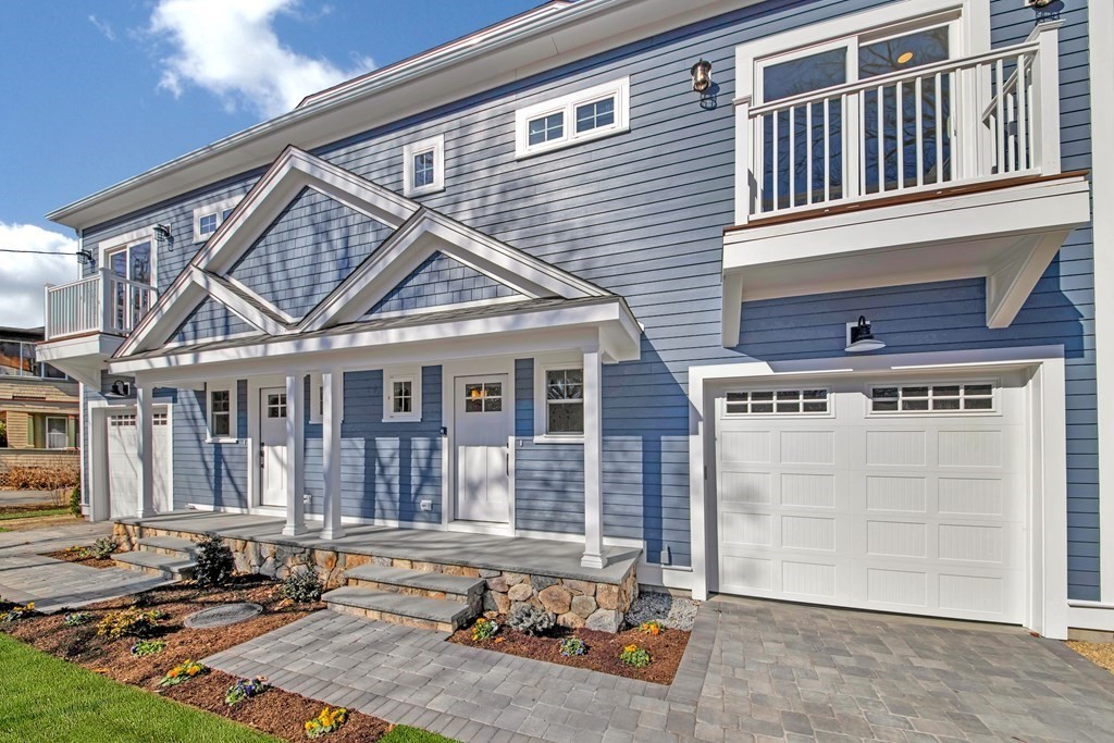401 Albemarle Road, Unit 1 Newton, MA 02460 - Photo 3 of 42 a front view of a house with a yard