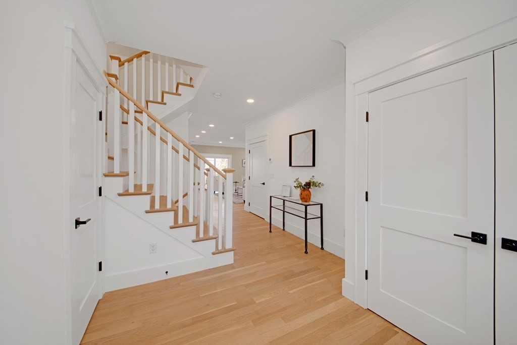 401 Albemarle Road, Unit 1 Newton, MA 02460 - Photo 4 of 42 a view of entryway and hall with wooden floor