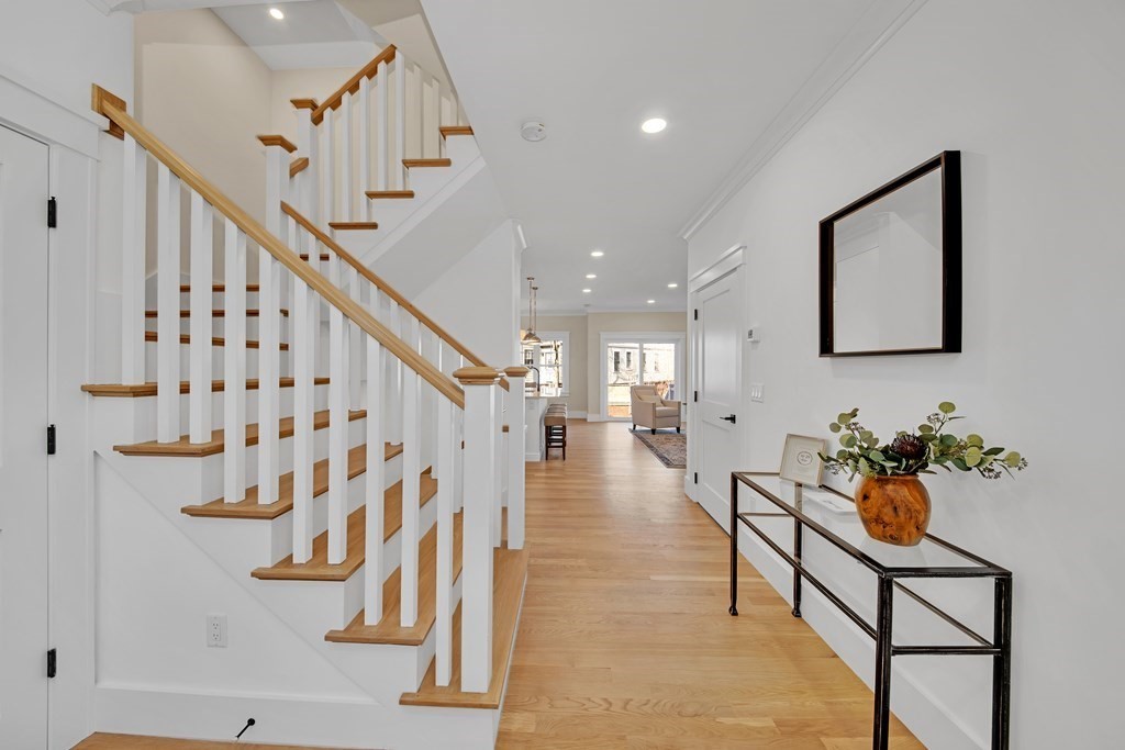 401 Albemarle Road, Unit 1 Newton, MA 02460 - Photo 5 of 42 a hallway with wooden floor and stairs