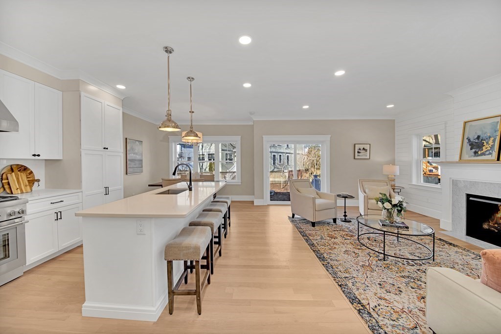 401 Albemarle Road, Unit 1 Newton, MA 02460 - Photo 6 of 42 a large kitchen with a table and chairs
