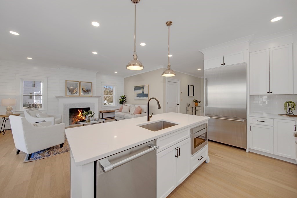 401 Albemarle Road, Unit 1 Newton, MA 02460 - Photo 10 of 42 a kitchen that has a lot of white cabinets and stainless steel appliances