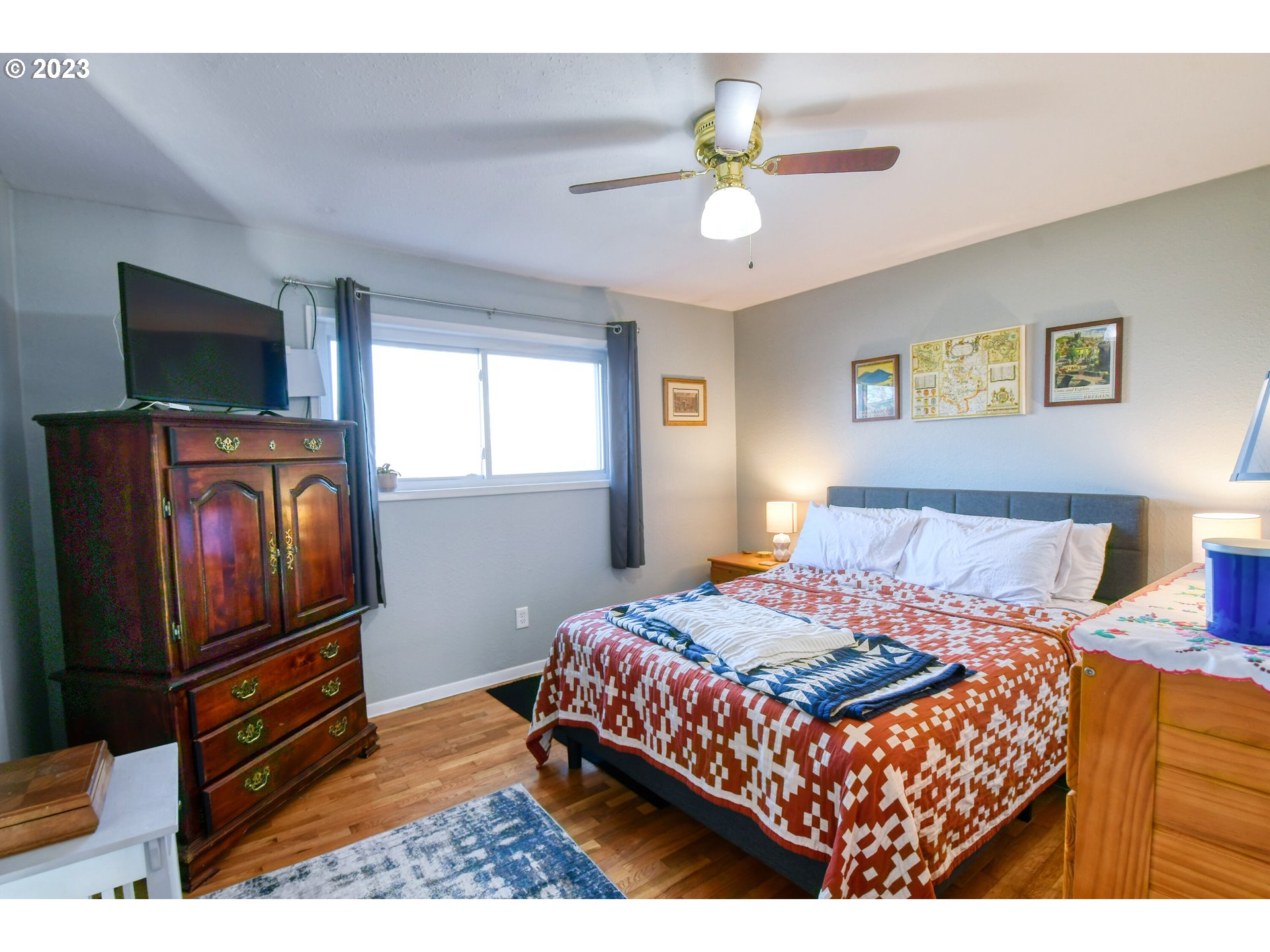 2437 Southwest Ladow Avenue Pendleton, OR 97801 - Photo 13 of 32 a bedroom with a bed and a flat screen tv